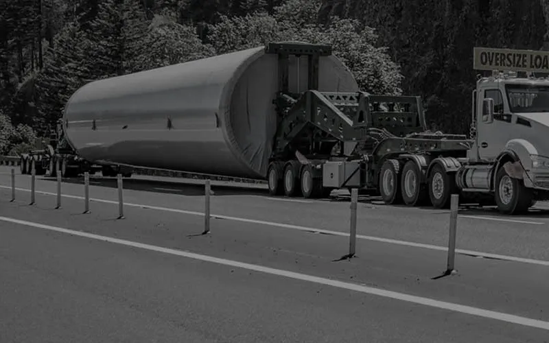 Aerospace tooling secured in a custom cradle on an open deck trailer